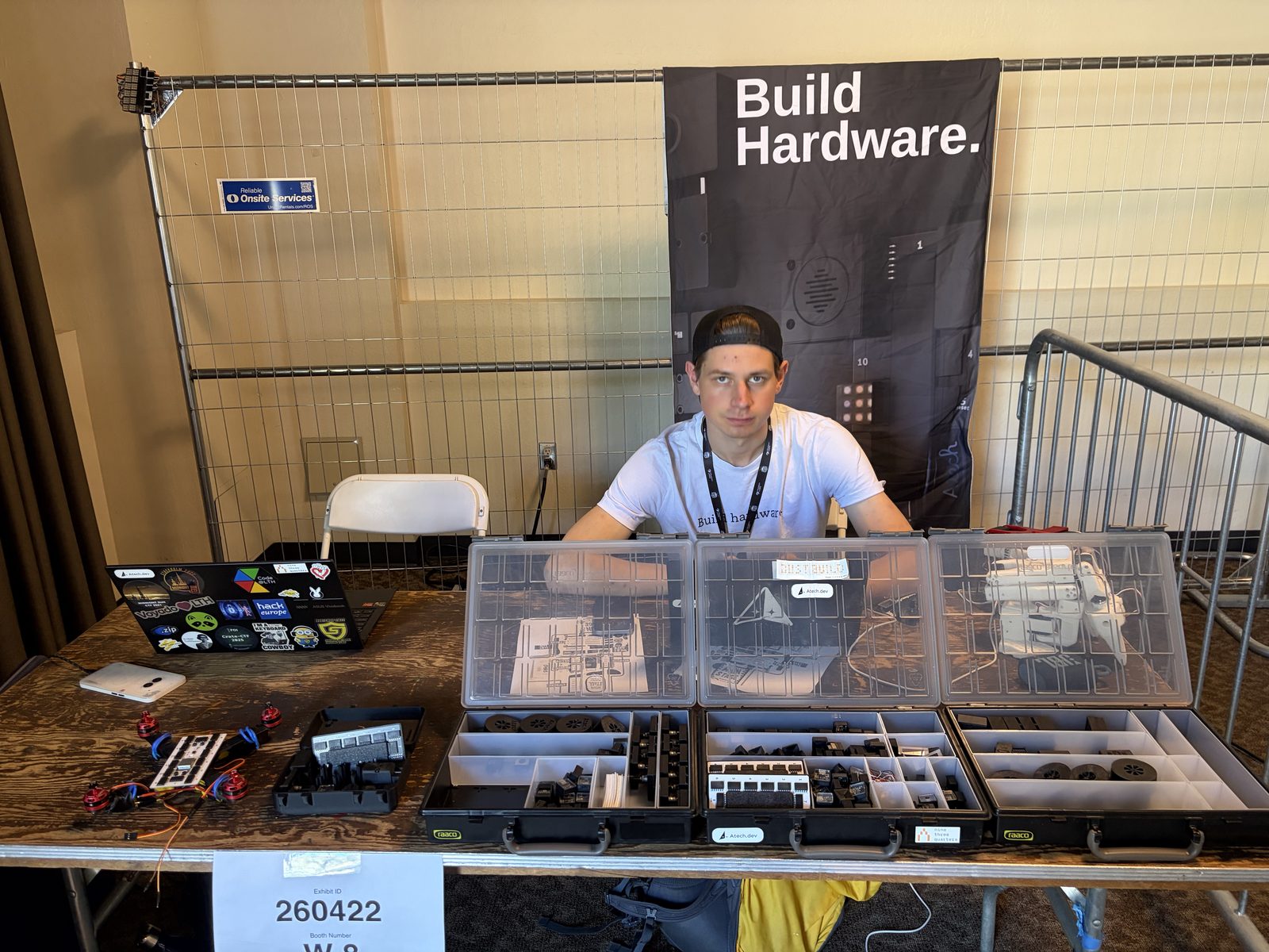 The Atech booth with the Build Hardware banner and open module cases