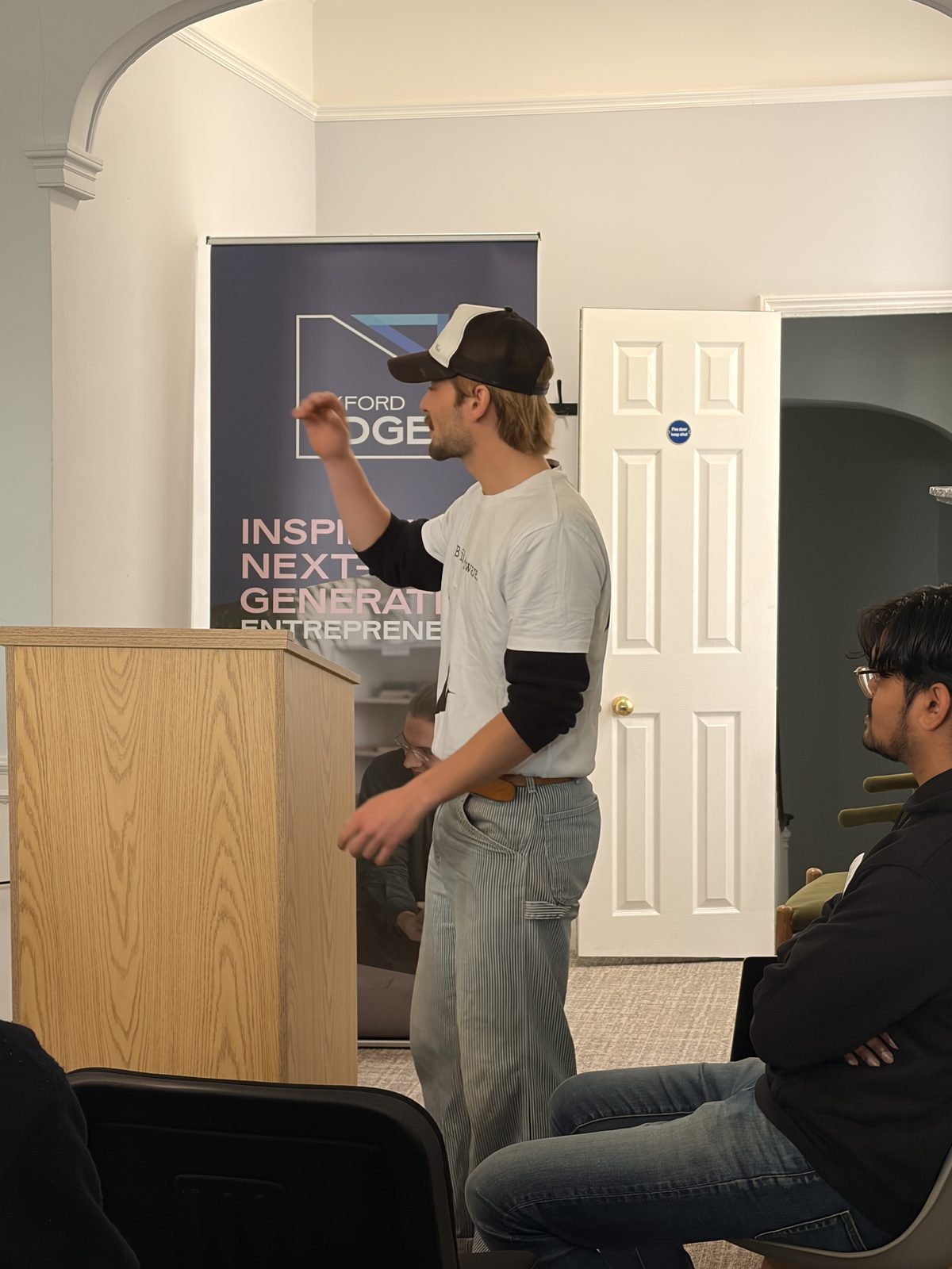 Gustav presenting beside the Oxford EDGE banner