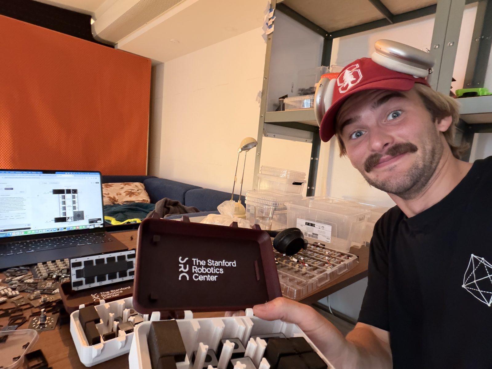Holding a finished Stanford Robotics Center kit case in the office