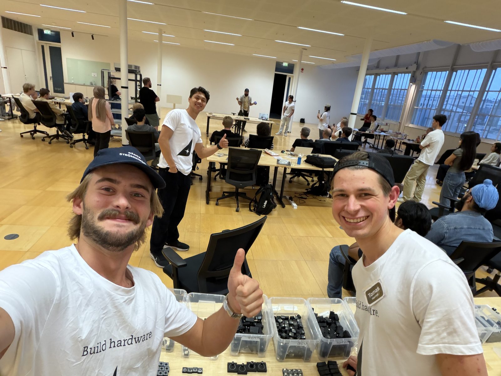 Gustav and a builder in Build Hardware shirts, thumbs up