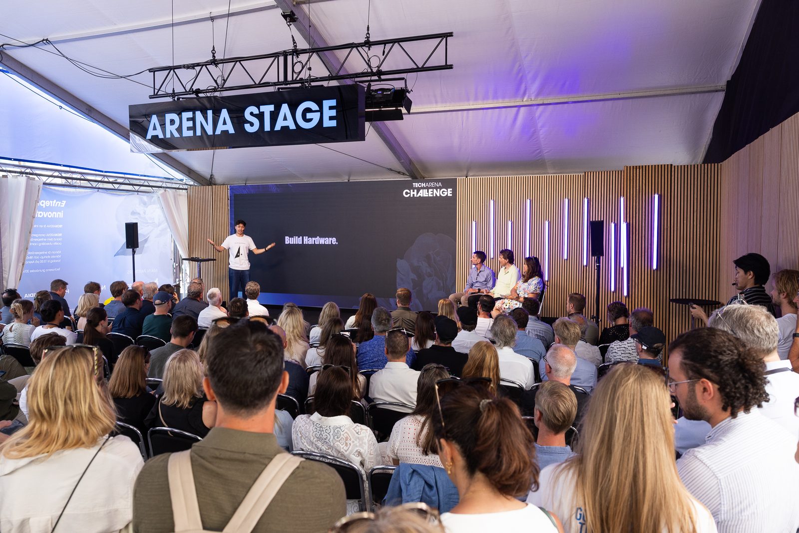 The arena stage and the audience in the tent